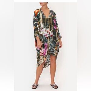 $699 Camilla v-neck dress with draped back Passport to paradise. 100% silk